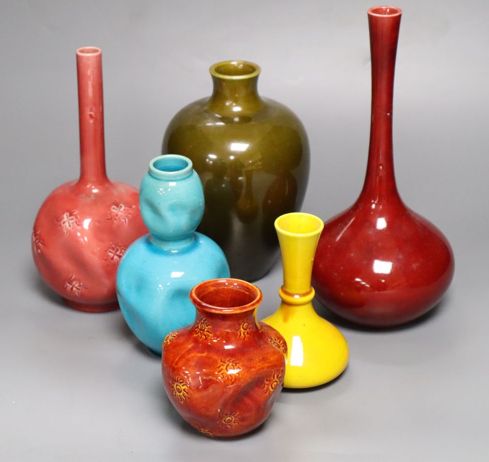 A collection of Burmantofts faience pottery vases, H 9cm to 23cm